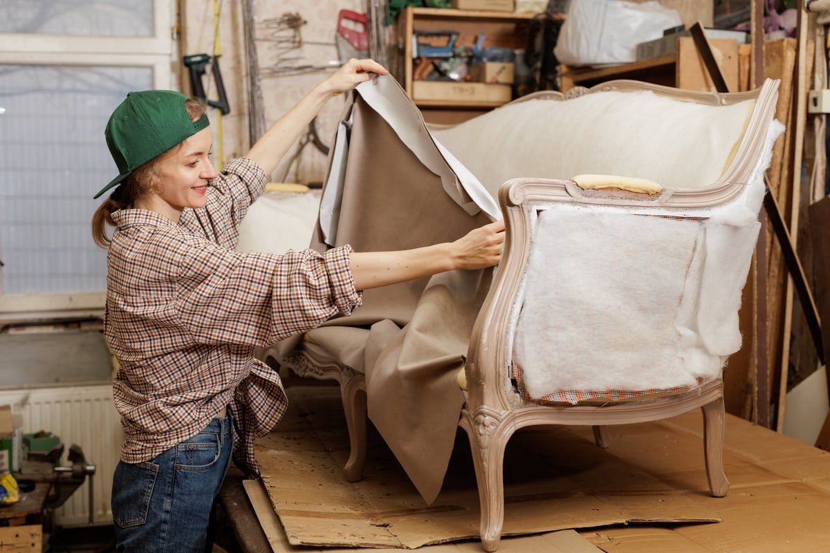 Skilled upholsterer working